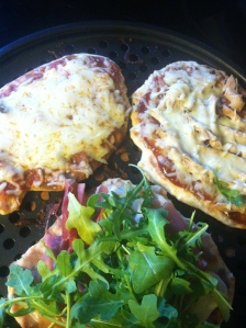 Cheese, BBQ Chicken, and Prosciutto Arugula Pizzas.